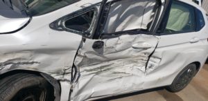 Vehicle damage to driver side door following car accident